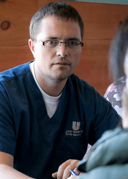 DR. JOHN WELLS, M.D.